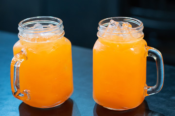 Punch juice in the glass on the table.