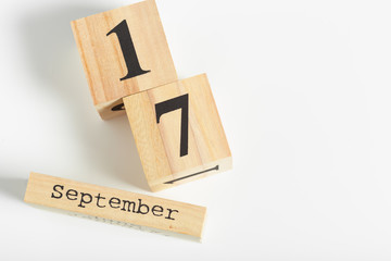 Wooden cubes with date on white background. 17th of September