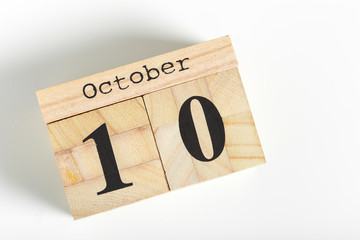 Wooden cubes with date on white background. 10th of October