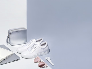 Women fashion accessories in white and gray colors.