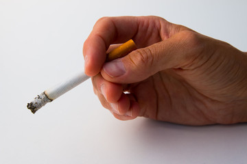 The tobacco burning between the woman's fingers in Finland.