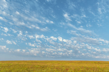 Blue sky and beautiful cloud. Plain landscape background