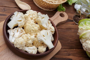 Organic cauliflower on wooden background