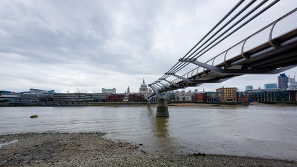 LONDON, UK - 15 Sep 2017: The Millenium footbridge is a steel suspension brideg connecting Bankside and the City of London over the Thames river.