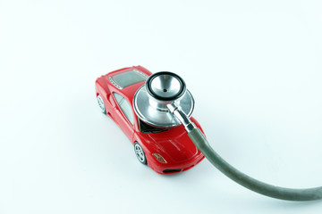 Stethoscope checking up the car on white background, Concept of car check up, repair and...