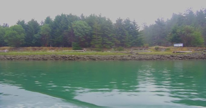 La Conner, WA tourist boat entering Puget Sound on a foggy summer morning