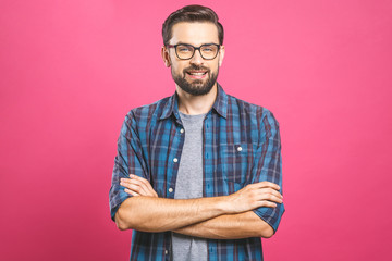 Young man with emotions on his face with a beard on a pink background, logo, copy space.