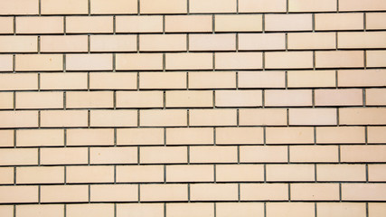 Yellow bricks in the wall as an abstract background