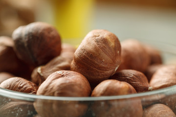 Hazelnut in glass bowl closeup shot, selective focus