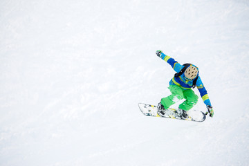 Photo of athlete riding snowboard