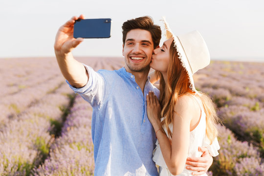Beautiful young couple taking a selfie