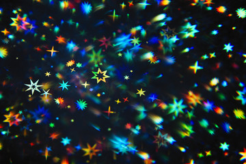Holographic star shapes photographed through prism for a warped galaxy effect