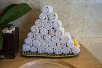 luxury white towel arrangement at toilet sink