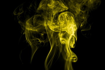 Yellow smoke on black background