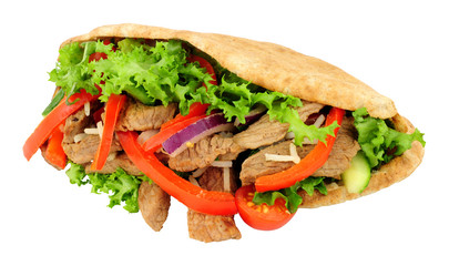 Beef and salad filled wholemeal pitta bread isolated on a white background