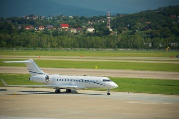 Fototapeta premium White private plane on runway
