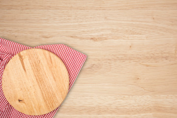 empty wooden cutting board and cloth red napkin