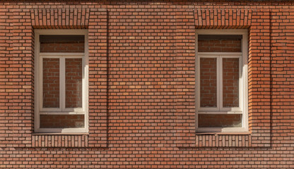 Fototapeta na wymiar Red brick wall and windows
