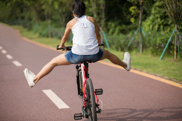 Woman riding bike have fun in park