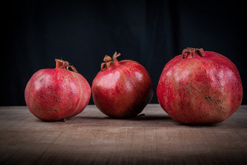 Fototapeta na wymiar pomegranates on a black background