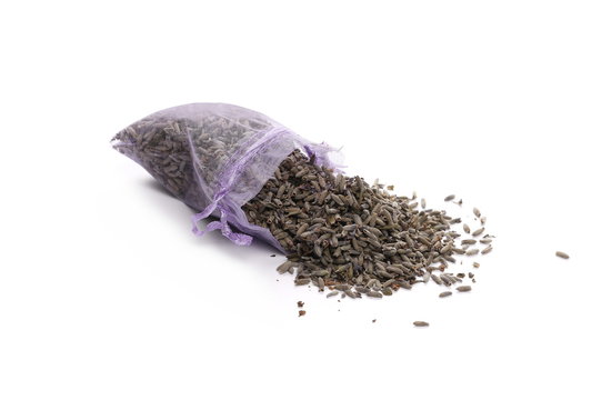 Fototapeta Dry lavender pile with purple pouch isolated on white background
