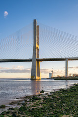 Ponte Vasco da Gama Bridge view near the Rio Tejo river at sunset