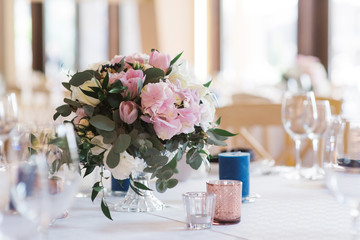 Bouquet of flowers on a wedding table. A beautiful wedding decor