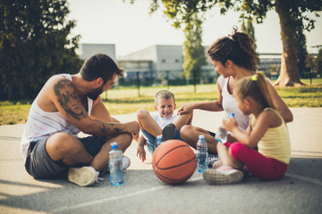 Happy family at playground.