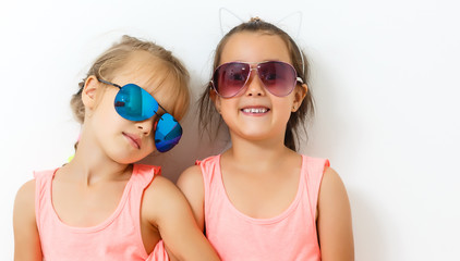 Portrait of two adorable little girls together during vacation