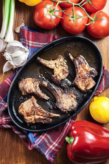 Roasted lamb chops on a roasting dish