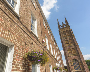 Medieval Church Tower next to Red Brick Georgian Building, Taunton Somerset Summer 2018