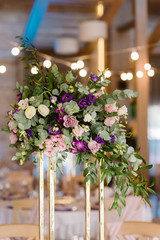 Magnificent decoration of a table for guests at a wedding.