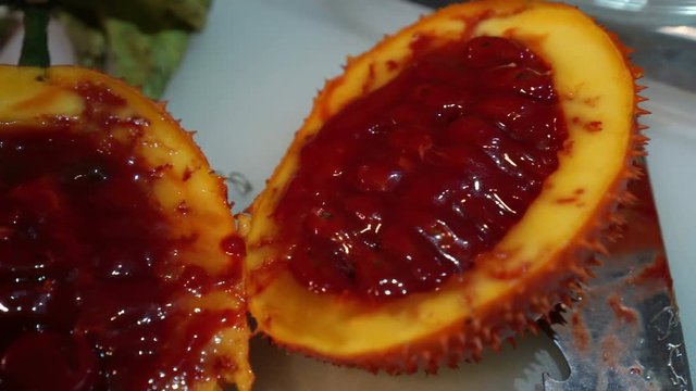 Gac fruit cut open, red healthy antioxidant food video