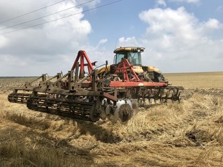 Harvester works on the field in harvesting