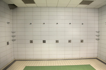 A place where swimmers can shower in a water park.