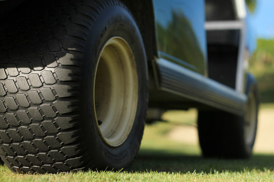 Wheels of a golf cart.