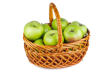 Green apples in wicker basket