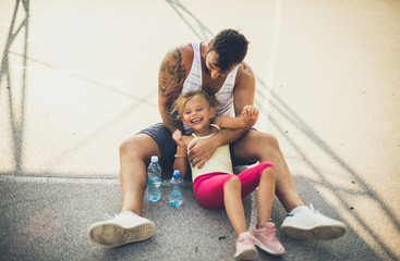 Father and daughter have fun at playground.