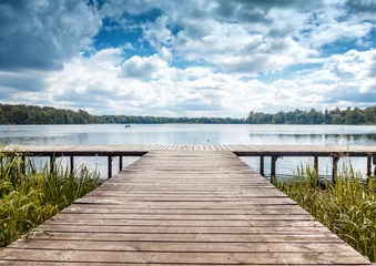 Acrylic prints Pier Beautiful summer landscape with dramatic sky, wooden pier on the lake, Trakai, Lithuania