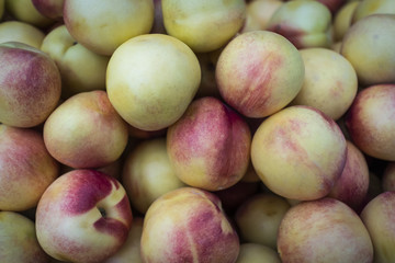 Ripe matte nectarines on the market. Autumn harvest.