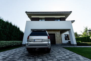 facade of new contemporary house with parking