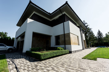 exterior of new modern house with car on parking