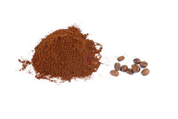 Pile of the ground coffee and few beans isolated on white background