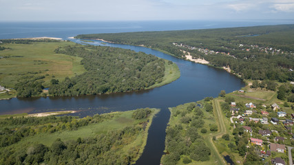 Fototapeta na wymiar Gauja river Latvia drain into Baltic Sea aerial drone top view