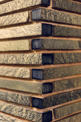 Abstract photography of brown bricks corner of wall.