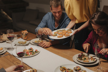 Friends Enjoying at Dinner Party