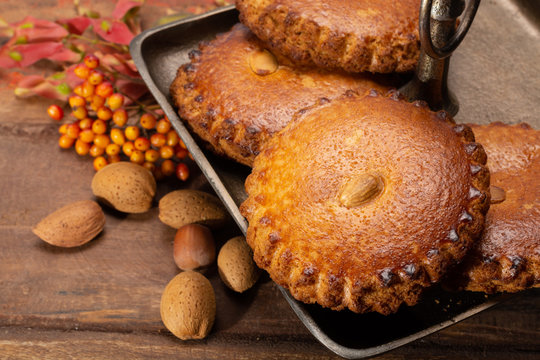 Round Dutch homemade cookies filled with marzipan and almonds nuts, autumn and winter seasonal dessert in Netherlands