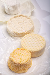 French AOC soft cow cheeses, crumbly Langres with washed rind structure, sharp Pie Angloys, camembert with strong taste and brie served as dessert after dinner