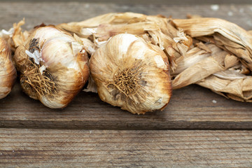 Bunch of smoked garlic on french village market