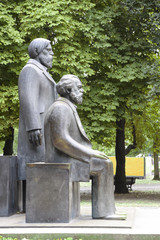 Fototapeta na wymiar Karl Marx and Friedrich Engels monument in the Marx-Engels-Forum, a public park in the central Mitte district of Berlin, Germany